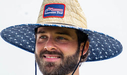 Lacrosse straw sun hat for men featuring a "Lacrosse Dad" patch and a patterned navy blue brim.