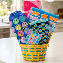 Volleyball gift basket featuring a t-shirt, towel, drawstring bag, socks, and a sticker.