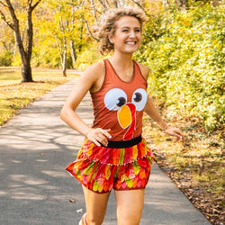 Thanksgiving running outfit featuring a turkey face tank top and colorful feather pattern ruffle tutu.