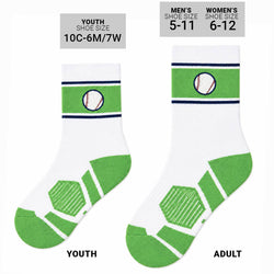 A pair of white crew socks with green athletic-style heel and toe panels, navy blue stripes, and a baseball graphic on the cuff, shown on a plain white background.