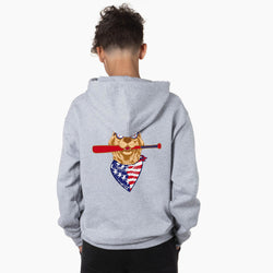 Person wearing a gray hoodie with a graphic of a dog holding an American flag and a baseball bat on the back.