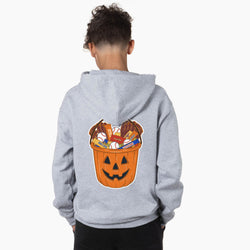 A child viewed from behind wearing a light gray hoodie with a large graphic of a jack-o'-lantern bucket filled with candy and baseballs on the back, set against a plain white background.