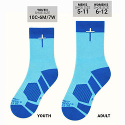 A pair of crew socks in light blue and dark blue, featuring a white/blue cross on the upper cuff and textured geometric patterns on the foot.