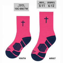 A pair of bright pink crew socks with navy blue accents, featuring a small embroidered cross on the upper cuff and textured navy heel and toe sections, displayed against a plain white background.