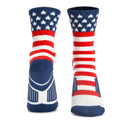 A pair of crew socks with an American flag design, featuring a navy blue cuff with white stars, red and white stripes, and a navy blue heel and toe section, shown against a plain white background.