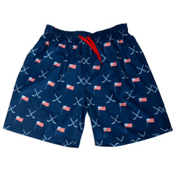Navy swim shorts with American flag and hockey stick pattern on a white background