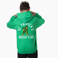 Person wearing a green hoodie with 'St. Patrick's Hockey Club' text and graphic on the back.