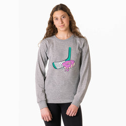 Person wearing a gray sweatshirt with a colorful hockey donut graphic design on a white background