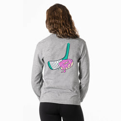 Person wearing a gray sweatshirt with a colorful hockey donut graphic on the back, standing against a white background