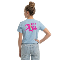 Woman wearing a light blue t-shirt with 'Girls with Goals' hockey girl graphic on the back.