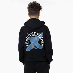 Person wearing a black hoodie with 'Fear The Keeper' graphic on the back