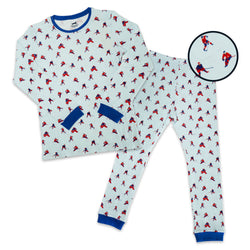 A two-piece kids' pajama set featuring a long-sleeve top and matching pants with an all-over hockey player print on a white background. The set has blue trim on the collar, cuffs, and pocket openings.
