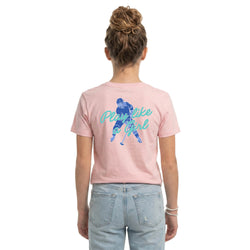 Person wearing a pink t-shirt with a hockey girl graphic and text on the back, standing against a white background