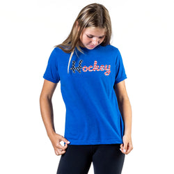 Person wearing a blue t-shirt with 'Hockey' printed on it against a white background