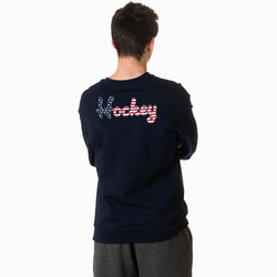 Person wearing a black sweatshirt with 'Hockey' text on the back, standing against a white background