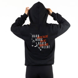 Black hoodie with motivational text on the back, worn by a person against a white background