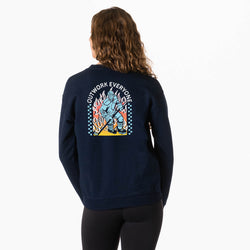 Person wearing a navy blue sweatshirt with a colorful hockey graphic on the back against a white background