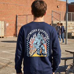 Person wearing a navy sweatshirt with 'Outwork Everyone' hockey design on the back in a school yard.