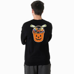 A man viewed from behind wearing a black crewneck sweatshirt with a large graphic on the back. The graphic shows a jack-o'-lantern bucket filled with candy and hockey pucks.