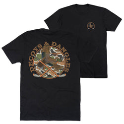 Two black tees showing the front and back of the tee. The graphic on the back features the words 'DECOYS & DANGLES' in a tan font surrounding a camouflage-patterned circle with a duck and crossed hockey sticks