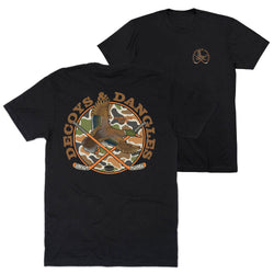 Two black tees showing the front and back of the tee. The graphic on the back features the words 'DECOYS & DANGLES' in a tan font surrounding a camouflage-patterned circle with a duck and crossed hockey sticks
