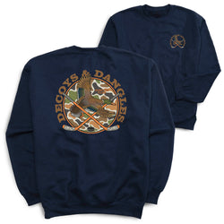 A navy crewneck sweatshirt shown from both the front and back. The back features a large circular graphic with a duck, crossed hockey sticks, and the text 'DECOYS & DANGLES' in brown. Small logo in a similar design on front.