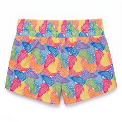 A pair of women's athletic shorts featuring a vibrant, all-over abstract pattern of lacrosse sticks in multiple bright colors including pink, blue, green, orange, yellow, and purple, set against a plain white background.