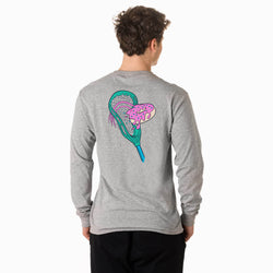 Person wearing a gray long-sleeve shirt with a colorful lacrosse stick head and donut design on the back, standing against a white background.