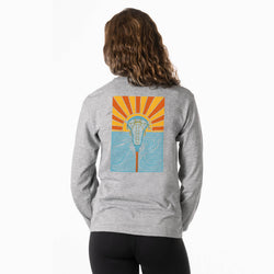 Person wearing a gray sweatshirt with a lacrosse graphic design on the back, featuring an sunset-themed illustration.