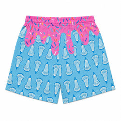 Light blue shorts with a repeating white and blue lacrosse pattern, featuring a bright pink waistband decorated with colorful sprinkles and dripping pink frosting graphics.