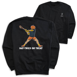 Two black crewneck sweatshirts shown on a white background, with the front and back views overlapping. The back sweatshirt features a large graphic of a person in orange shorts and a pumpkin head swinging a lacrosse stick, with the text 'HAT-TRICK OR TREAT' below.