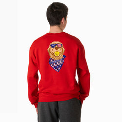 Person wearing a red sweatshirt with a patriotic graphic of a pickleball dog on the back, on a white background