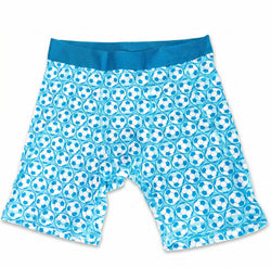 Flay lay of blue soccer themed compression shorts with soccer ball patterned design