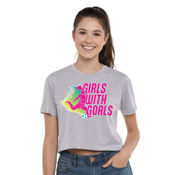 Woman wearing a gray t-shirt with 'Girls with Goals' graphic design on a white background