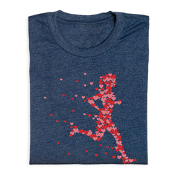 Folded blue t-shirt with red heart-shaped running figure on a white background