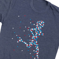 A close-up of a heather navy blue t-shirt featuring a graphic of a running figure composed of red, white, and blue stars.