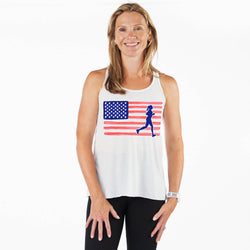 Woman wearing a white tank top with an American flag and running figure design on a white background