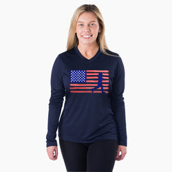 Woman wearing a navy long-sleeve shirt with an American flag and silhouette design on a white background