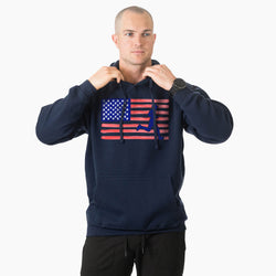 Man wearing a navy hoodie with an American flag design on a white background