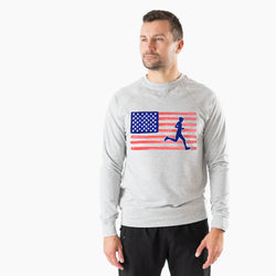 Man wearing a gray sweatshirt with an American flag and running figure design on a white background