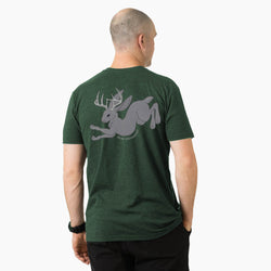 Man wearing a green t-shirt with a jackalope graphic design on the back, standing against a white background