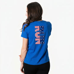 Woman wearing a royal blue t-shirt with a U.S. flag design on the back against a white background