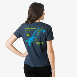 Woman wearing a navy blue short sleeve tee with New york City marathon route design on the back.