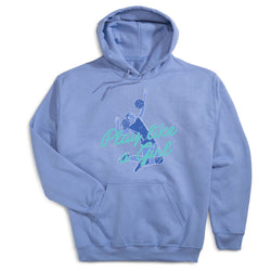 A light blue pullover hoodie with a graphic of a volleyball player and the text 'Play like a Girl' in blue and teal on the front, displayed against a plain white background.