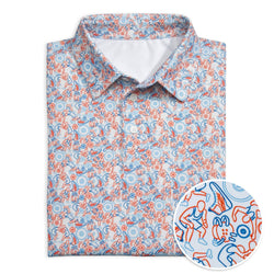 Folded polo shirt with a colorful wrestling pattern on a white background