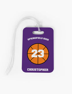 Custom basketball bag tag featuring orange ball graphic and personalized text for team, name, and number.