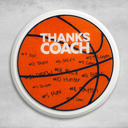 Round basketball coach gift plaque featuring Thanks Coach text and personalized team signatures.