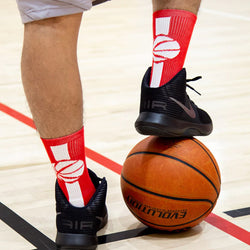 Red and white basketball crew socks featuring a white basketball silhouette on a red stripe.