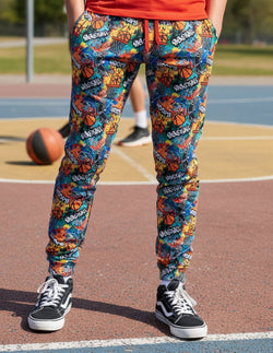 Colorful basketball lounge pants featuring a vibrant graffiti pattern with hoops and balls.