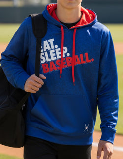 Boy wearing blue performance baseball hoodie featuring red drawstrings and Eat Sleep Baseball slogan.